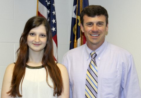 Principal Chase Ferrell congratulates Corinth Holders senior Nicole Kroushl for being selected as a winner of the Eaton Scholarship.