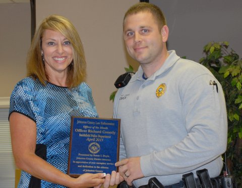 (Left to Right) Johnston County District Attorney Susan Doyle presents the April Law Enforcement Officer of the Month Award to Smithfield Police Officer Ricky Conerly.