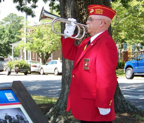 Ken Parker with the Marine Corps League Detachment 1236, and a Vietnam Veteran, plays Taps during the Memorial Day Ceremony.