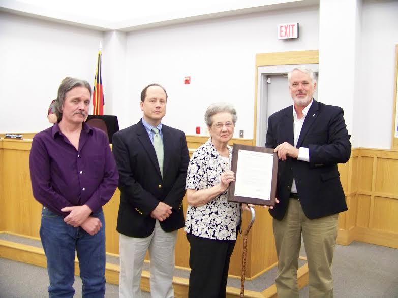 (Caption) Smithfield Mayor John Lampe (far right) presents a proclamation remembering the legacy of former Mayor Norwood Worley to his family including his wife, Jean, and two sons, Earl and Paul.