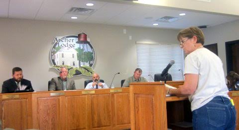 Archer Lodge resident Debbie Barnes raises questions about spending and conflict of interest before the Archer Lodge Town Council. Her concerns prompted Town Councilman Mark Wilson to vote against approving the town budget, which still passed.
