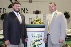 Pictured: (Left to right) South Johnston High football coach Hunter Jenks is congratulated after being named the school's new athletic director by incoming Principal David Pearce.