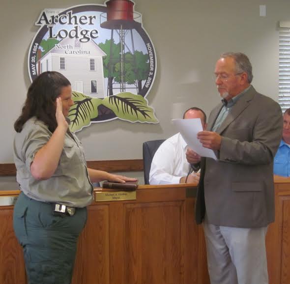 (Left to right) Clayton Animal Control Officer Angela Lee is sworn in as animal control officer in Archer Lodge by Mayor Mike Gordon.