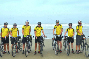(Left to right) NC Boy Scouts David Margolies, Brian Richardson, Alex Broz, Andrew de Figueiredo, Max Morgan, Will Owen, Sam Billings, pose for a photo June 15th at the Pacific Ocean starting point of Florence, Oregon before departing for a 3,900 mile cross country bike road trip ending August 18 in Wrightsville Beach, NC.
