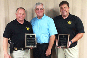 Sheriff Steve Bizzell (center) with Detective Kevin Massengill (left) and Lt. Gary Bridges (right).