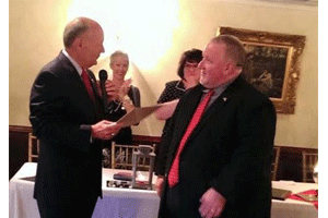 (Left to right) NC Senator Brent Jackson presents retired Smithfield Fire Chief Patrick Harris the Order of the Long Leaf Pine.