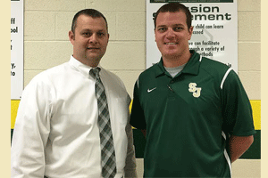 Brody Massengill (right) stands with Principal David Pearce (left) after being named the new athletic director for South Johnston High School.