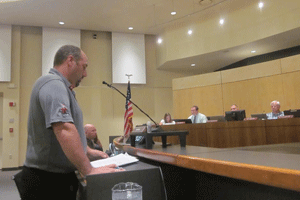 Michael Orlowski (left) speaks in opposition to a 38 home subdivision before members of the Clayton Town Council. WTSB Photo