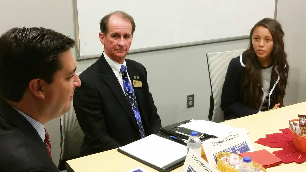 Congressman David Rouzer (R-NC) talks with Neuse Charter School student body president Marika Samuelsson while his Smithfield office director Dwight Williams listens. Rouzer selected Neuse Charter School as the first charter school in his district to visit since taking office in January. Photo by Shannon Mann