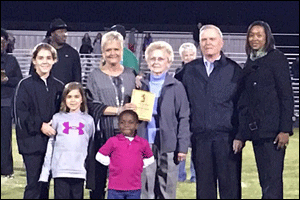 Front Row (Left to right): Riley Trueblood and Mia Trueblood (Godchildren). Back row: Caleb Rankins, Elizabeth Upton, mother Joyce Upton, father Steve Upton, J.H. Rose Principal Monica Jacobson.