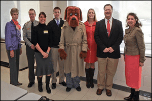 S.A.V.E. Day visitors (from left) are SAVE Coordinator Suzanne Phillips, Clayton Police Chief R.W. Bridges, Clayton Information officer Stacy Beard, Allstate's Stephen Medlin, McGruff, West Clayton Principal Kristina Benson, Johnston County Schools Deputy Superintendent Ross Renfrow, and Johnston County Board of Education member Donna White.
