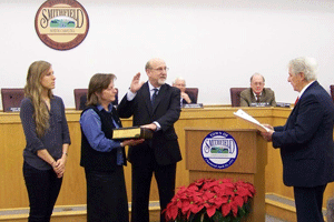 Councilman Emery Ashley receives his oath of office from retired District Court Judge T. Yates Dobson Jr. Ashley was elected to his second term. He was also named Mayor Pro-Tem for 2 years.