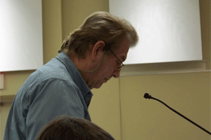 Jim Dempster speaks before Clayton Town Commissioners Tuesday night in opposition of a major development on NC42 at Glen Laurel Road near his home. WTSB Photo
