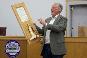 Mayor John Lampe presented several light-hearted mementos to the new mayor and town council Tuesday night, including the Golden Agitator Award to Councilman Perry Harris. The plaque featured a real agitator removed from a Whirlpool washing machine and painted gold. The plaque was signed by 3 Smithfield mayors.