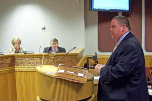 Todd Davis with Moseley Architects, a former major with the Alamance County Sheriff’s Office, discusses the need for a new Johnston County Public Safety Center, as Commissioners Cookie Pope and Ted Godwin look on. WTSB Photo