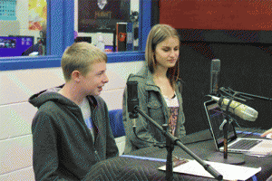 Freshman Josh Williford (left) and junior Sydney Riggs (right) work together during Wednesday's High School Radio Day broadcast.