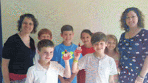 Students who participated in the Four Oaks Elementary LEGO Movie-Making Competition on the front row are competition winners Jack Rowland (left) and Elijah Hudson (right). Those on the back row (from left) are Four Oaks Elementary Principal Kathy Parrish, contestants Raiden Simmons, Christian Fiske, Jaren Godwin, Katie Lee and technology teacher Kelly Nolan.