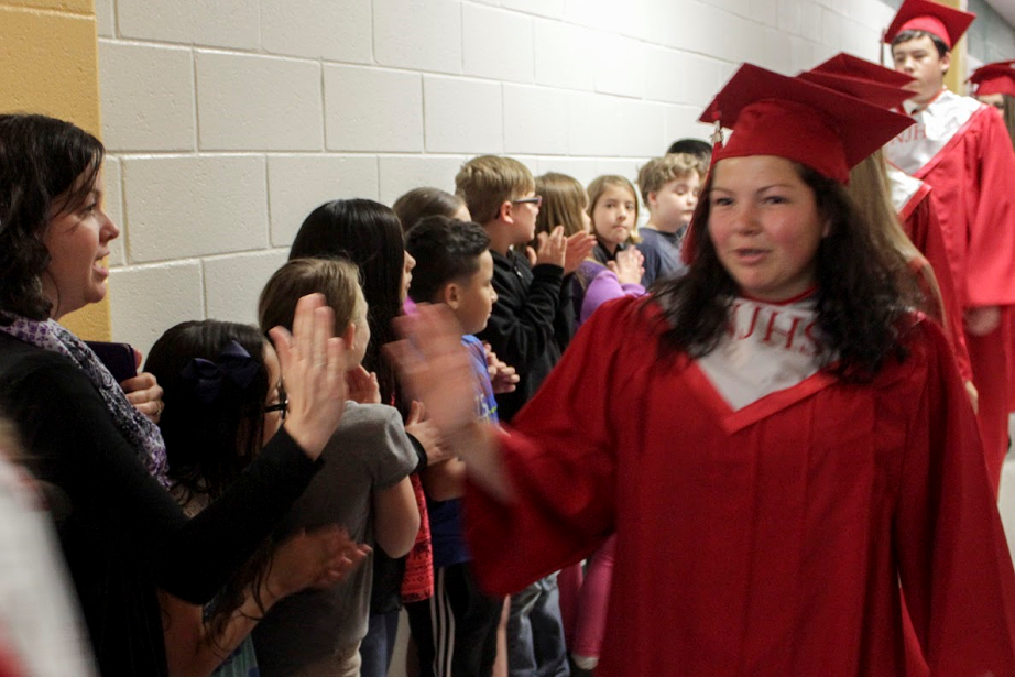 North Johnston High senior Emma Turner (right) is congratulated by Micro-Pine Level Elementary teacher Katie Speer (left).