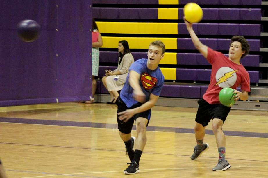 Superhero Squad team members Erik Oehler (left) and Ryan Stein (right) give it their all during the Corinth Holders High FCA Dodgeball Tournament.