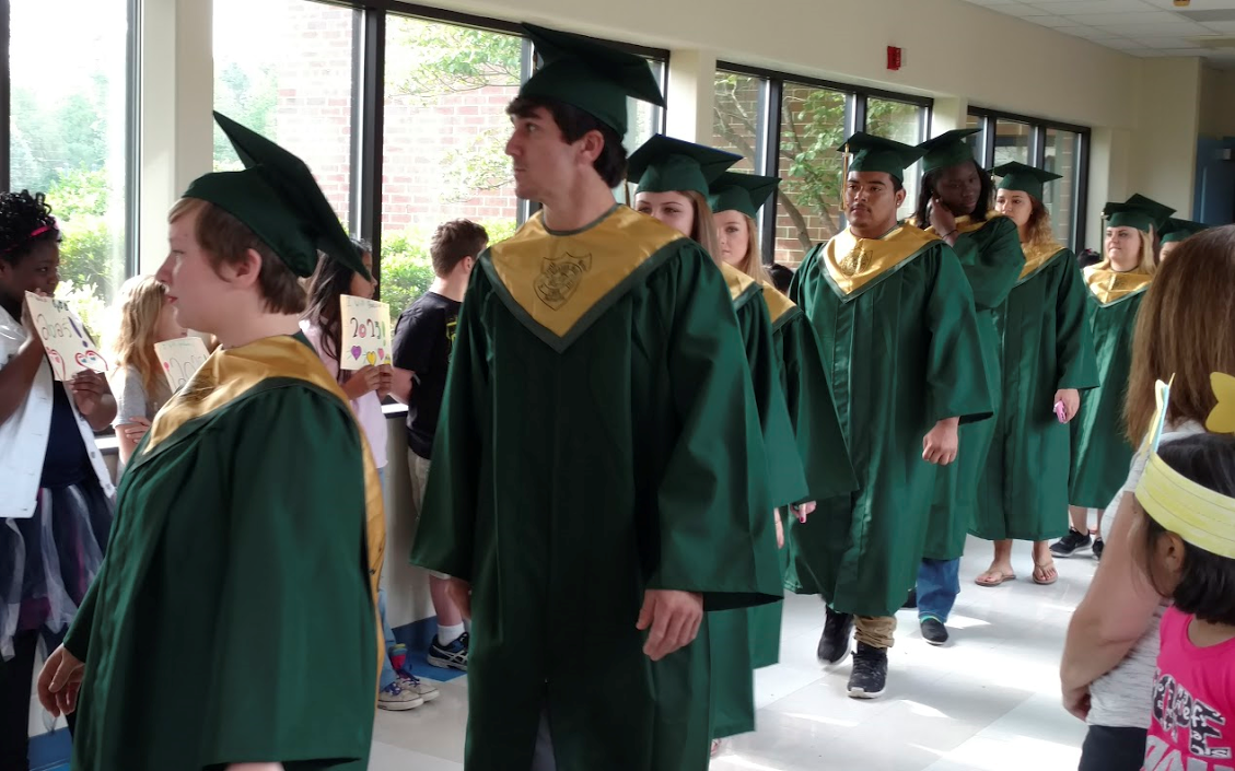 South Johnston seniors (from left) Haley Westbrook, Joseph Johnson, Skyler Johnson, Alicia Lee, Victor Balthazar, Tiyanna Chance, Alex Woodall, and Katlyn Gainey are welcomed by students at Benson Elementary.