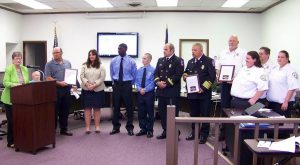 Selma Mayor Cheryl Oliver (left) recognizes officials from Sysco, the Selma Fire Department and Selma EMS whose combined efforts saved the life of Sysco employee and Archer Lodge fireman John Dusek on May 20th. JoCoReport.com Photo