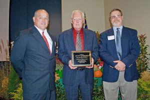 (Left to right) Johnny Hayes, Hilton Byrd, and Kent Denning with Carolina Packers are honored by the Johnston County Farm-City Committee in November 2015. Contributed photo.