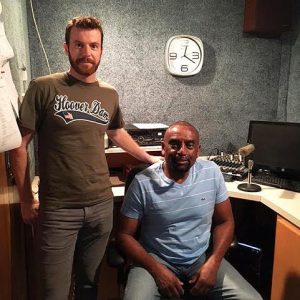 Rev. Jesse Lee Peterson (seated) and his producer James Hake complete their live 3 hours radio show in California from a studio at AM-1270 WMPM in Smithfield on Thursday.