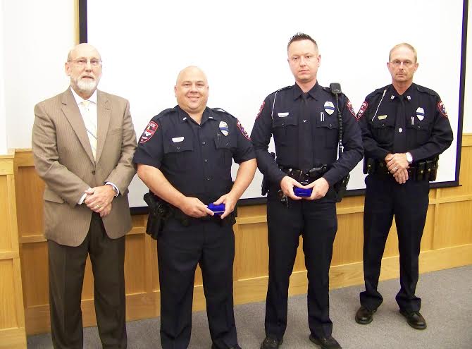 (left to right) Mayor Pro Tem Emery Ashley, Lt. Ryan Sheppard, Officer Sean Cook, and Interim Police Chief Keith Powell at Tuesday night’s Smithfield Town Council meeting. JoCoReport.com Photo