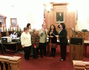 Former school board member and newly-elected county commissioner receives his Oath of Office from Clerk of Court Michelle Ball. JoCoReport.com Photo