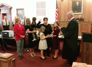 Joined by her sister, daughter and three grandchildren, Teresa Grant receives her Oath of Office for the Johnston County School Board from District Court Judge O. Henry Willis. JoCoReport.com Photo